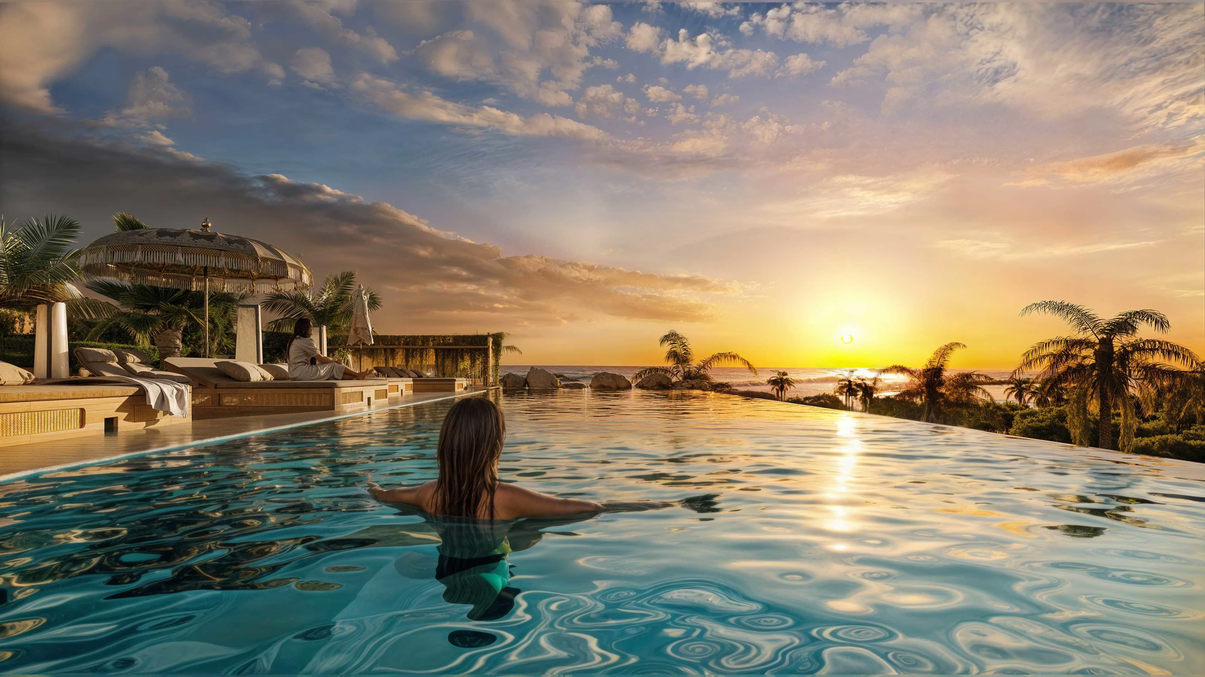 Amani Melasti sunset pool deck and ocean-facing hospitality area